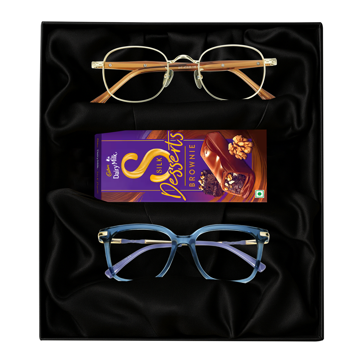 Two pairs of glasses and Cadbury Dairy Milk gift box