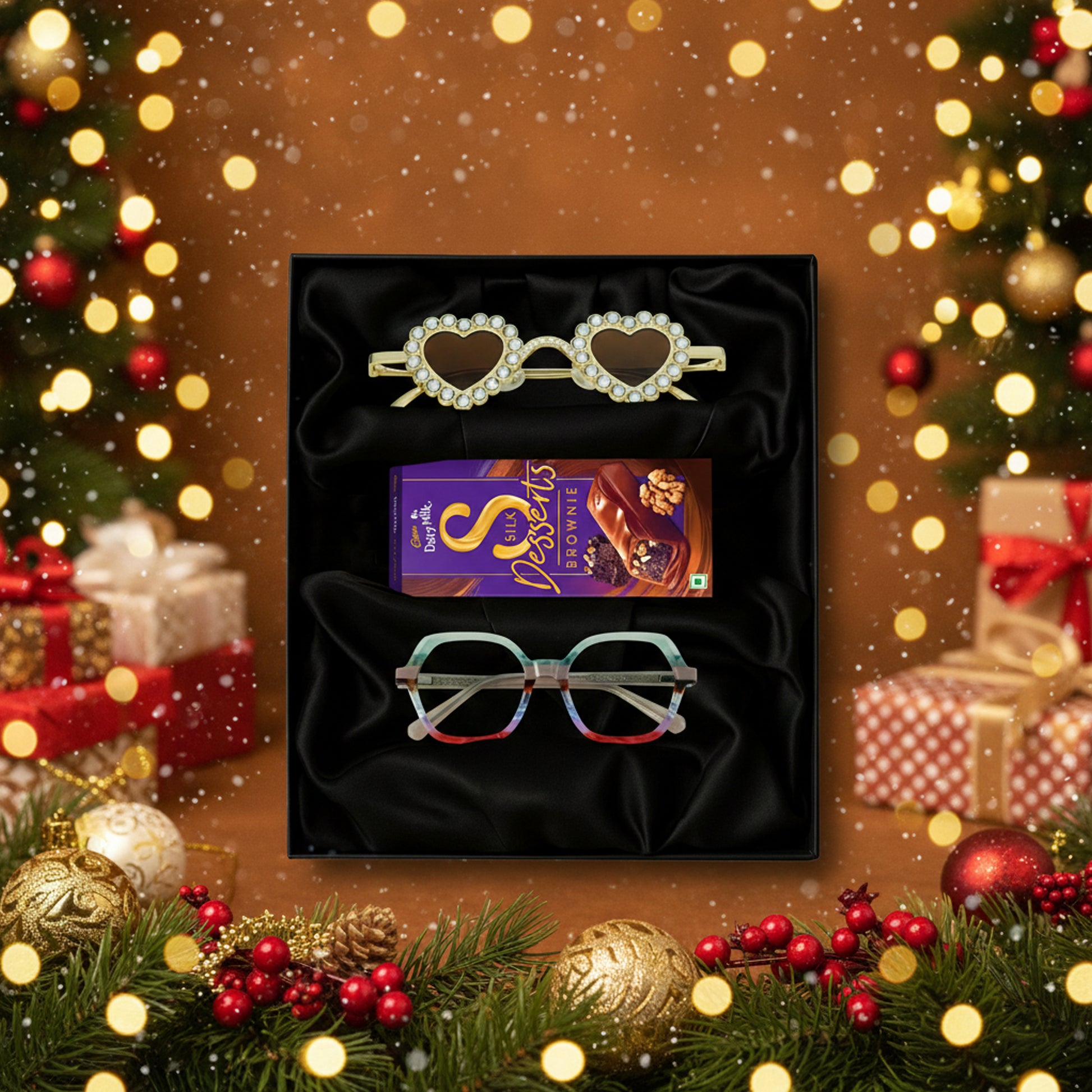 Cadbury Dairy Milk Sweets, and a pair of eyeglasses on a black gift box