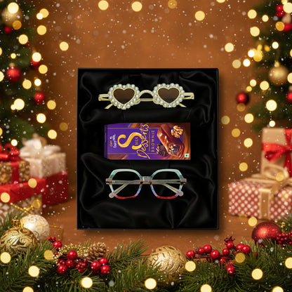 Cadbury Dairy Milk Sweets, and a pair of eyeglasses on a black gift box