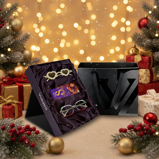 Cadbury Dairy Milk Sweets, and a pair of eyeglasses on a black gift box